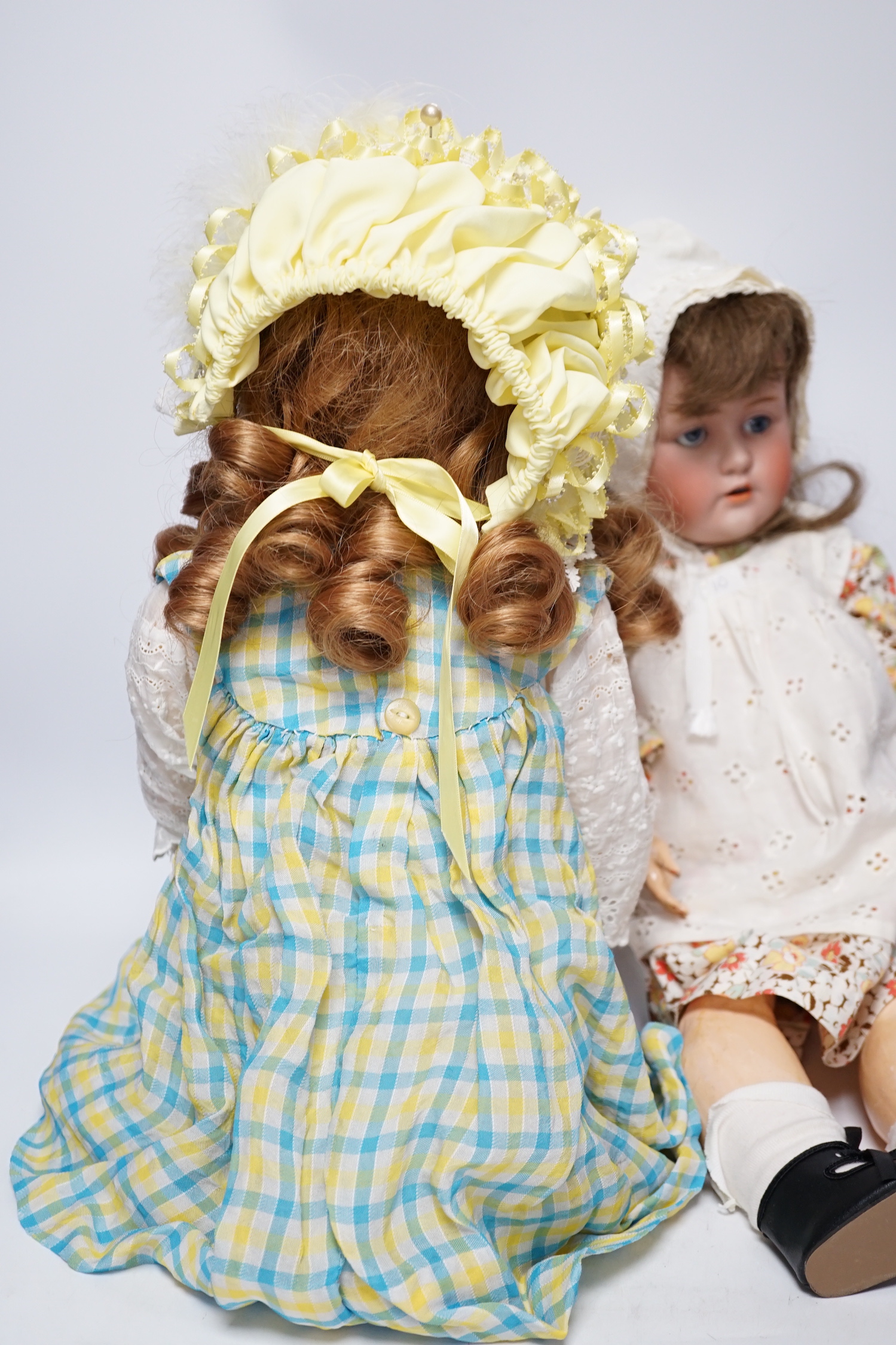 A Kestner JDK 168 bisque doll, 65cm and an AM390 doll with bisque head, 65cm